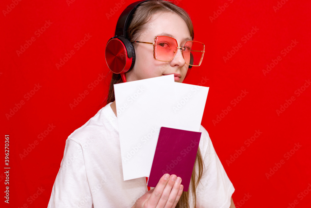 Beautiful teen Girl With Passport And Flight Tickets, on red background. Beautiful teen Girl With Passport And Flight Tickets, on red background.