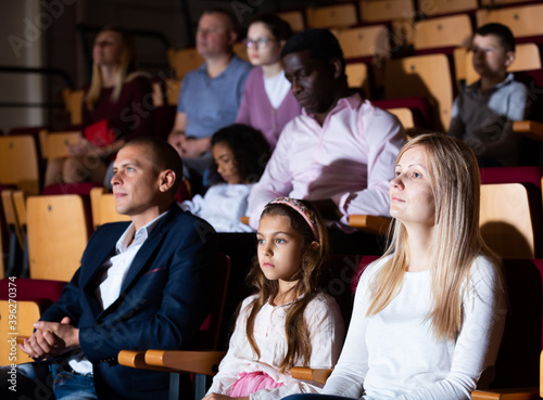 Family viewing of spectacle or concert in the theater auditorium
