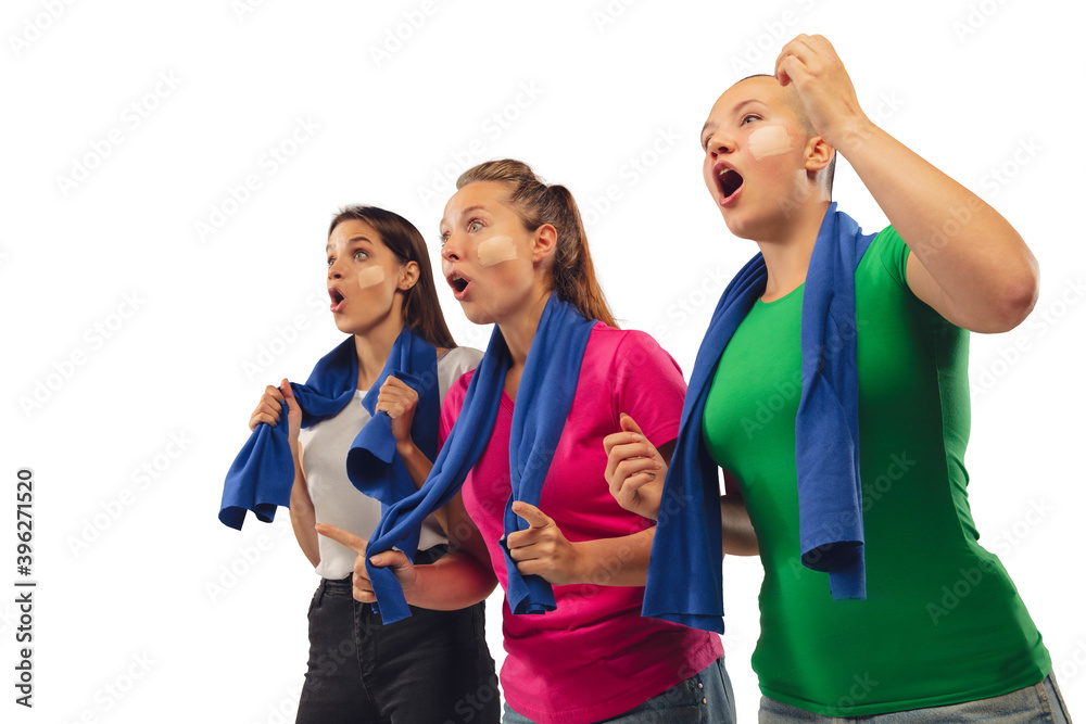 Goal. Female soccer fans cheering for favourite sport team with bright emotions isolated on white studio background. Beautiful caucasian women look excited, supporting. Concept of sport, fun, support. Goal. Female soccer fans cheering for favourite sport team with bright emotions isolated on white studio background. Beautiful caucasian women look excited, supporting. Concept of sport, fun, support.