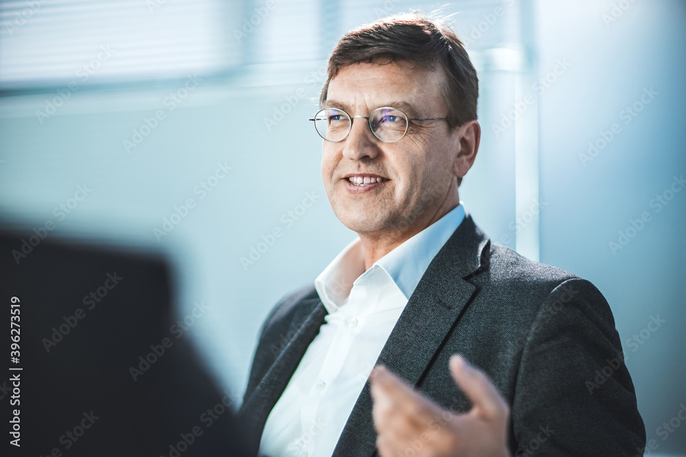 close up. senior business man standing in the office