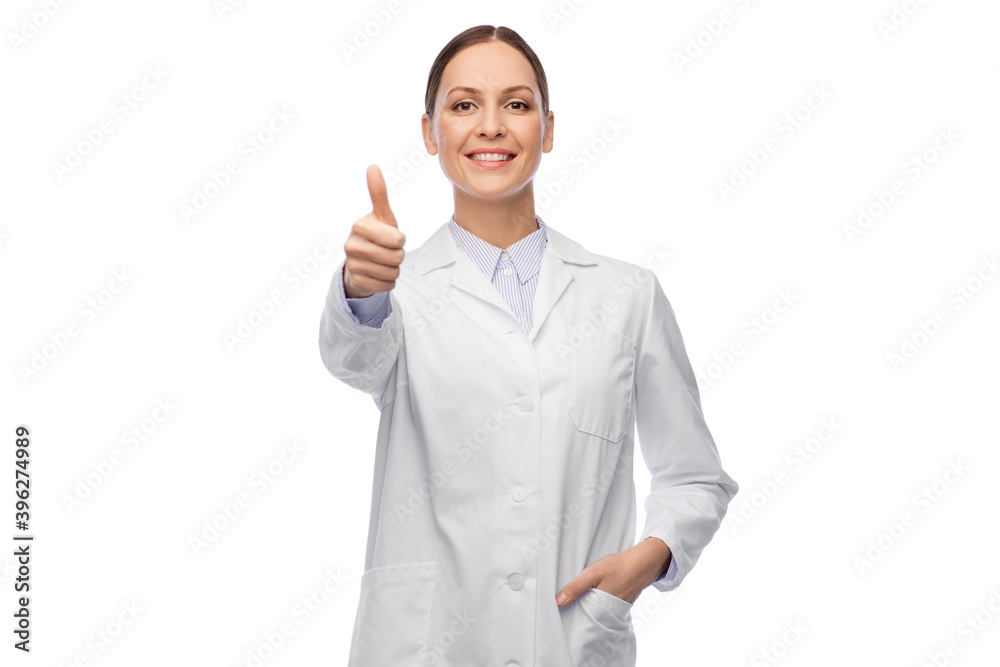 medicine, profession and healthcare concept - happy smiling female doctor in white coat showing thumbs up medicine, profession and healthcare concept - happy smiling female doctor in white coat showing thumbs up