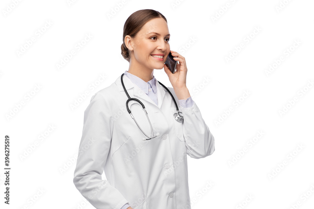 medicine, profession and healthcare concept - happy smiling female doctor with stethoscope calling on smartphone over white background medicine, profession and healthcare concept - happy smiling female doctor with stethoscope calling on smartphone over white background