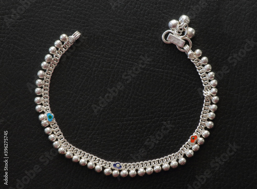 Fotografie Indian style silver anklet with beads.