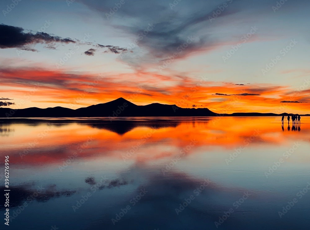 Beautiful sunset Dramatic sky Surreal red heaven Mirror reflection Unique nature Alien planet landscape Romantic silhouette Andes mountain Reflection cloud sea water Solitude land Dream Fantasy Night.