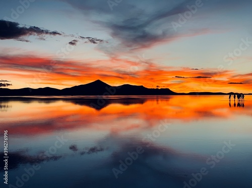 Beautiful sunset Dramatic sky Surreal red heaven Mirror reflection Unique nature Alien planet landscape Romantic silhouette Andes mountain Reflection cloud sea water Solitude land Dream Fantasy Night.