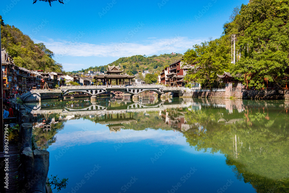 Naklejka premium Scenery of old houses in Fenghuang City, Hunan Province, China. The ancient city of Fenghuang is regarded by UNESCO as a World Heritage Site.
