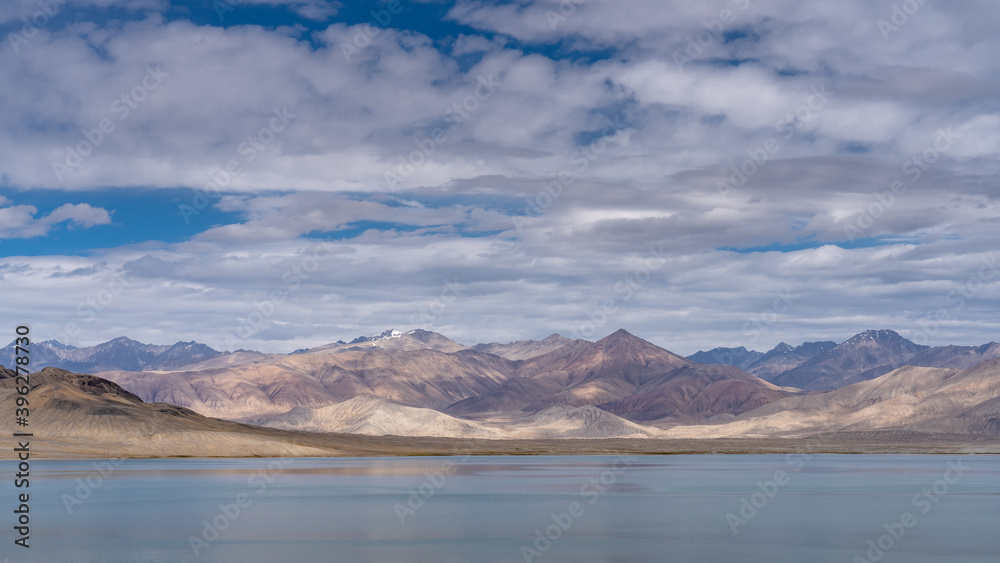 Panoramic view of high-altitude Sassykkul lake with mountain background along the Pamir Highway between Bulunkul and  Alichur in Gorno-Badakshan, Tajikistan