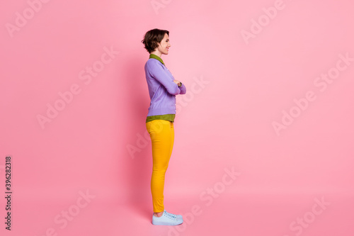 Full size profile photo of attractive lady arms crossed confident student wear jumper pants sneakers isolated pink color background