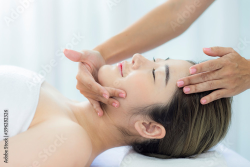Woman receiving head massage at a spa