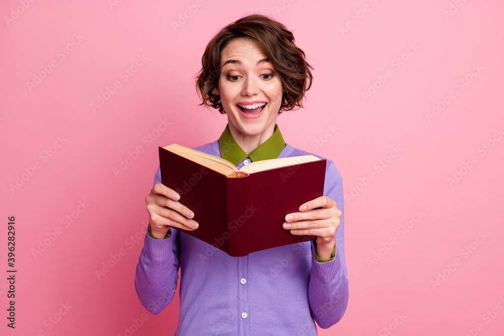Photo of funny lady open mouth read historic novel wear purple jumper isolated pink color background Photo of funny lady open mouth read historic novel wear purple jumper isolated pink color background
