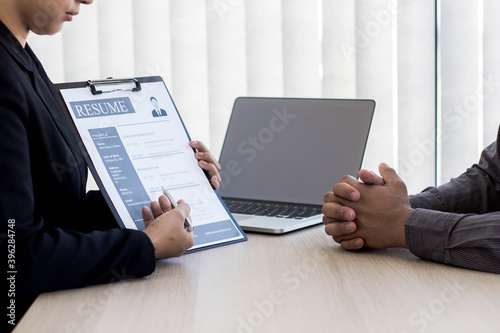 Job seekers are presenting themselves to the manager at the job interview.