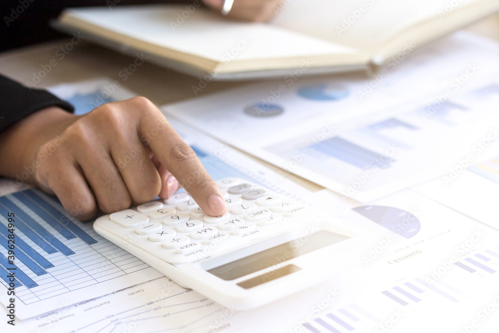 Close up The accountant's hand is using a calculator. Close up The accountant's hand is using a calculator.