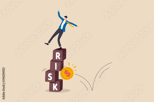 Investment risk, volatility and fluctuation in stock market that price will drop, stability and uncertainty concept, businessman investor falling from stack block with word RISK impact by money coin.