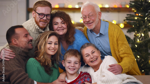 Portrait of multi-generation family celebrating christmas together