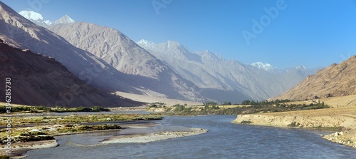 Panj river and hindukush mountains panoramic view photo