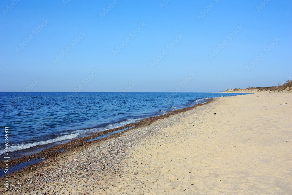 Sandy shore of the blue Baltic Sea