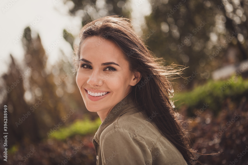 Photo of flirty coquette lovely young lady look camera shiny smile wear brown shirt park street outdoors Photo of flirty coquette lovely young lady look camera shiny smile wear brown shirt park street outdoors