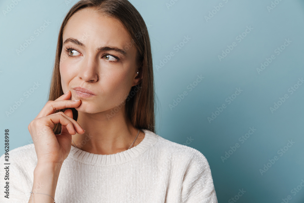 Brooding beautiful woman posing and looking aside Brooding beautiful woman posing and looking aside
