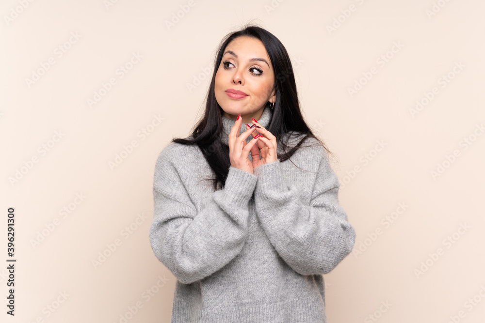 Young Colombian girl over isolated background scheming something Young Colombian girl over isolated background scheming something