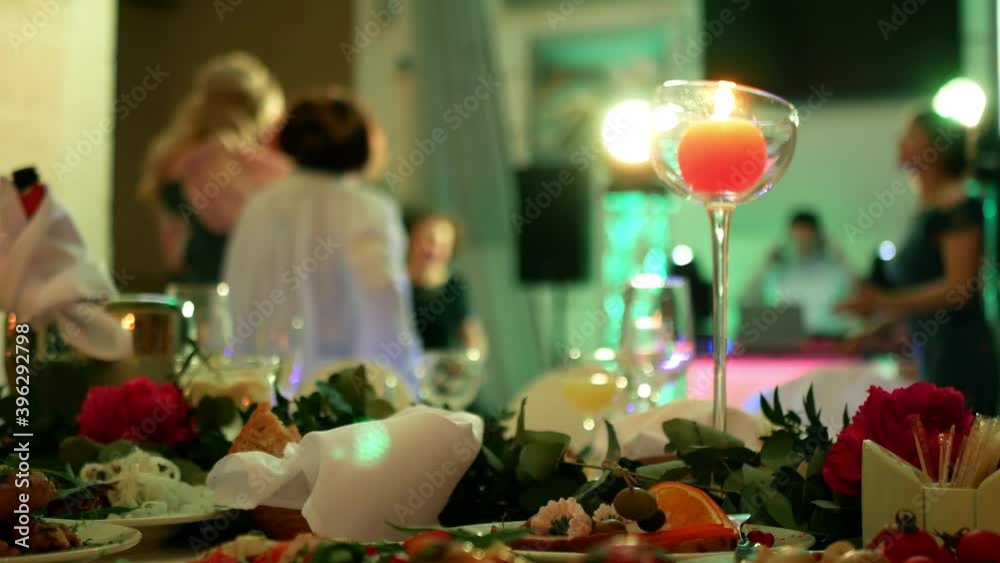 Celebration of solemn joyful holidays. Guests are dancing on the dance floor in the beams of disco light and music Celebration of solemn joyful holidays. Guests are dancing on the dance floor in the beams of disco light and music