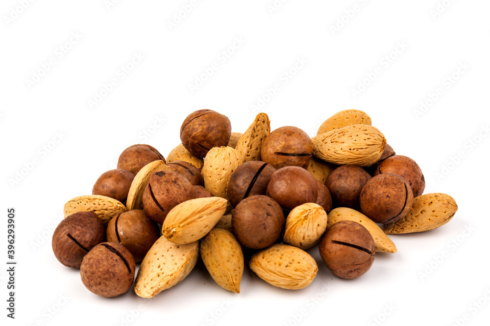 Assorted Nuts. Background of nuts - macadamia, almonds, isolated on white background Assorted Nuts. Background of nuts - macadamia, almonds, isolated on white background