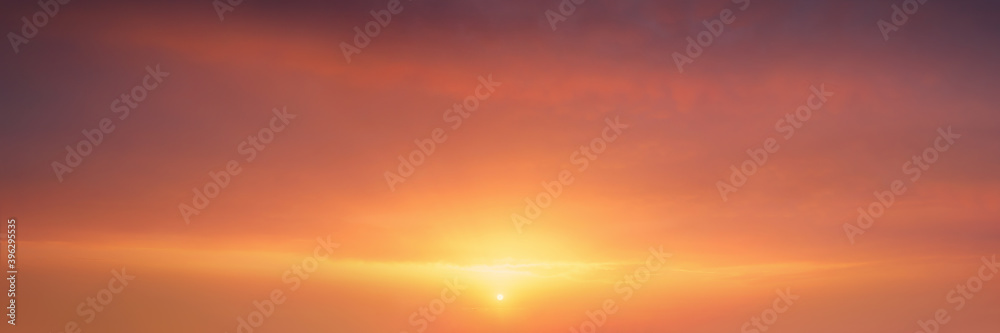 background of cloudscape at the sunset with sunshine on sky and red clouds