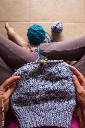 Home crafts, woman knits from thick yarn