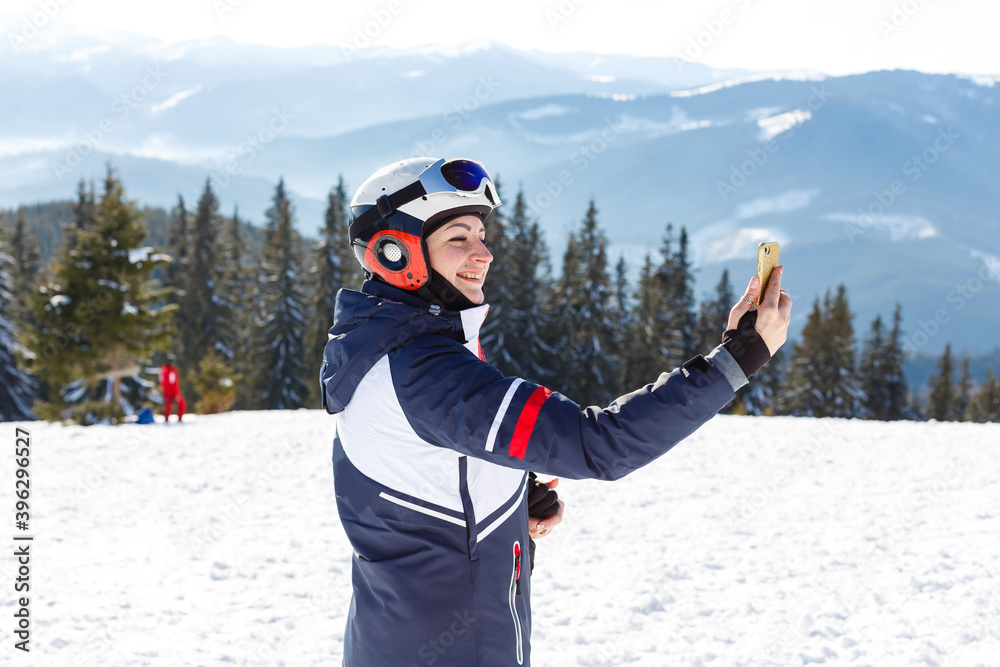 Woman skier enjoy in winter sunny day, holiday