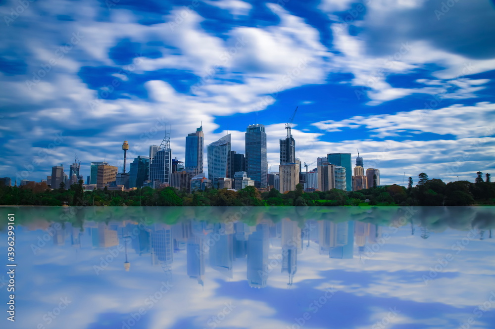 Naklejka premium vibrant colours of Sydney CBD with reflection of buildings in the bay