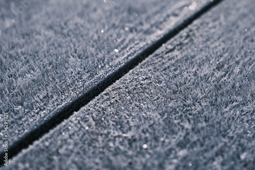 The surface of the white fresh snow frost winter on a wooden background close up for design © Stanislav