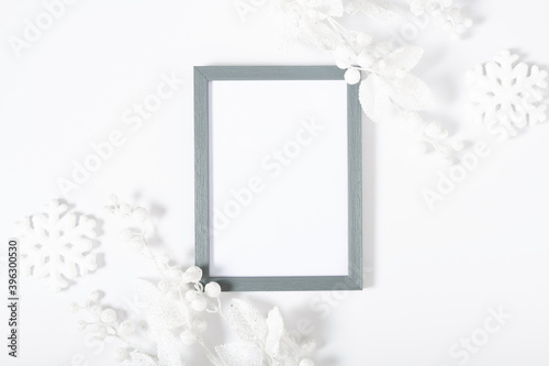 Christmas, winter composition. Xmas decorations, photo frame on white background. Christmas, New Year, winter concept. Flat lay, top view, copy space