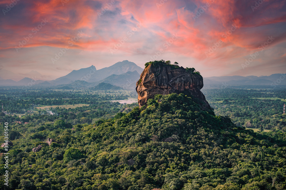 Spectacular view of the Lion rock surrounded by green rich vegetation. Picture taken from Pidurangala Rock in Sigiriya, Sri Lanka.