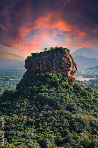 Obraz na płótnie Spectacular view of the Lion rock surrounded by green rich vegetation. Picture taken from Pidurangala Rock in Sigiriya, Sri Lanka. w salonie