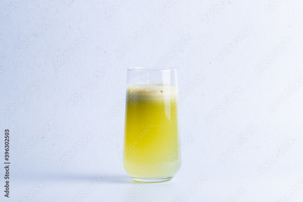 Healthy apple juice in a glass isolated on a white background close up.