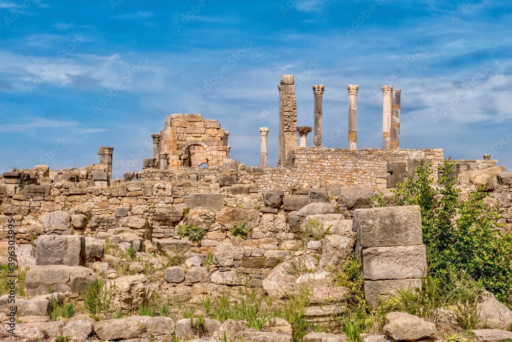 The partially restored ruins of the Basilica and Capitoline Temple in the ancient Roman city of Volubilis, near Meknes, Morocco.