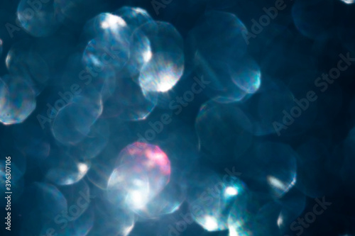 beautiful iridescent blurred festive bokeh background toned trendy color photo