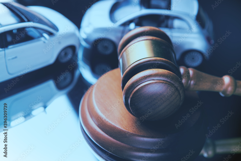 Model of car and gavel. Accident lawsuit or insurance, court case. Model of car and gavel. Accident lawsuit or insurance, court case.