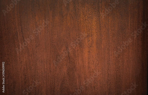 Dark wood texture is used for the background. Wood plank background