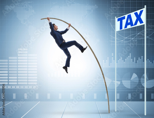 Businessman jumping over tax in tax evasion avoidance concept © Elnur