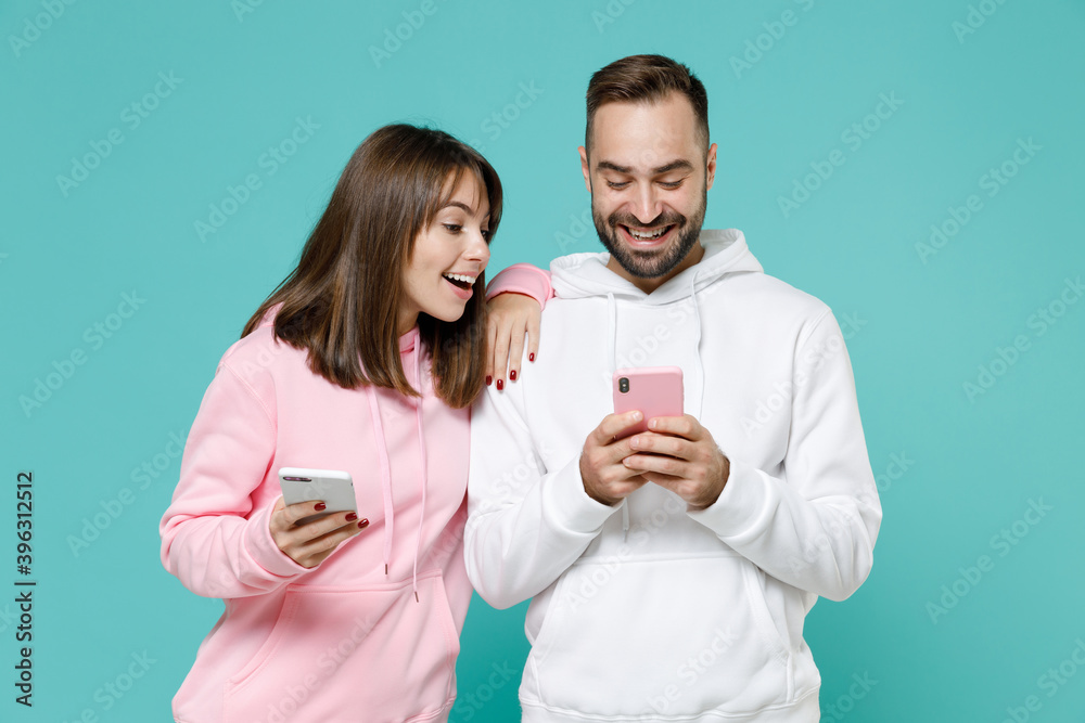 Funny cheerful young couple two friends man woman 20s wearing white ...