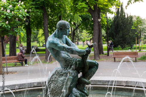 Sculpture of man fighting with snake in fountain in park kalemegdan fortress Belgrade