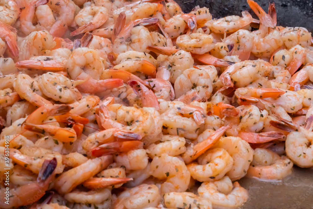 Process of cooking fresh red king prawns on grill at summer local food market - close up view. Outdoor cooking, gastronomy, seafood, barbecue, street food concept Process of cooking fresh red king prawns on grill at summer local food market - close up view. Outdoor cooking, gastronomy, seafood, barbecue, street food concept