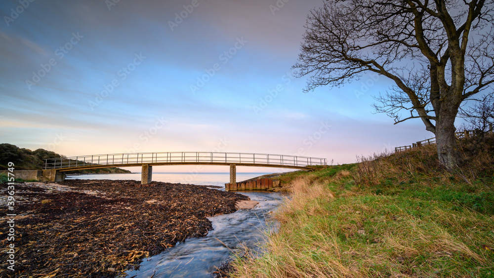 Howick Burn Coastal Path Footbridge, on the shoreline at Howick on the Northumberland coast AONB
