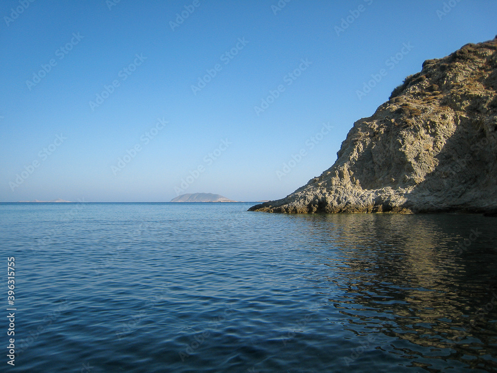 Calm sea and a rock reflection