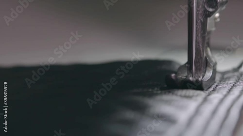 A seamstress sews leather using a special walking foot