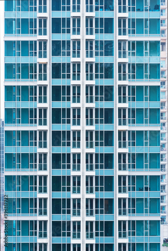 Exterior of high rise residential building. Modern architecture abstract background pattern © leeyiutung
