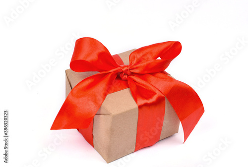 Bright Christmas, New Year, Valentine's present, made of craft paper with red ribbon, isolated on white background