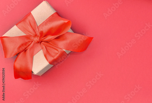 Bright Christmas, New Year, Valentine's present, made of craft paper with red ribbon, isolated on white background. Mock-up. Greeting card, flat lay. Copy space.