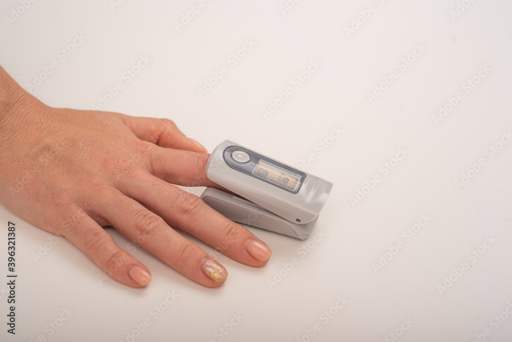 Female hand with a measuring device saturation. Blood oxygen level in coronavirus Female hand with a measuring device saturation. Blood oxygen level in coronavirus