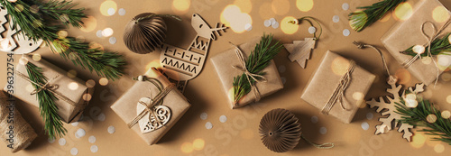 Kraft paper gift box on brown background, christmas, holidays and eco theme